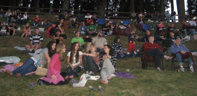 A crowd gathers for a showing during the city of Arlington’s Outdoor Movies and Karaoke event during the summer of 2011.