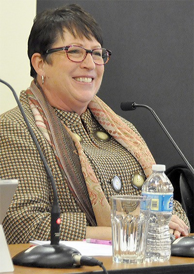 Debora Nelson smiles as the Arlington City Council discusses her potential to take over the mayor pro tem position.