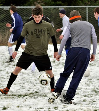 Senior defender Nick Welch practices cutting with the ball.