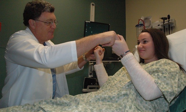 Cascade Valley Hospitalâ€™s Dr. Mark Leonard administers a strength test to Grace Meno during a follow-up exam for her concussion.