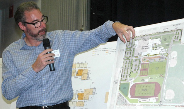 Michael McGavock with plans for remodeled and new schools.