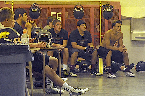 Lakewood's football team listens to instructions before the start of practice.