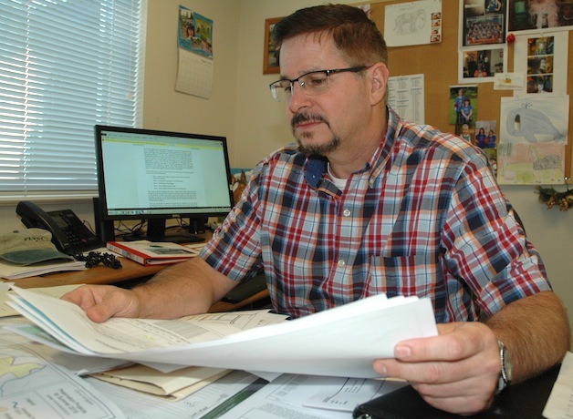 Arlington Public Works director Jim Kelly reviews city plans.