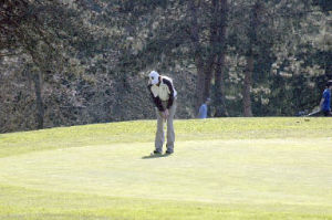 Arlington junior Tyler Kent putts in his team-high 82-stroke performance at Snohomish Golf Course.