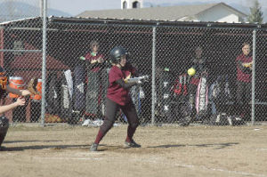 Senior Kally Behen rips a two-run double in the third inning. “She’s awfully tough