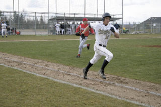 Senior Caleb Scarth sprints for first.