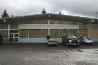 Arlington Cenex Co-Op Supply Branch Manager Zeek Maier stands outside the former Safeway building