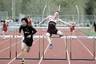Senior Jordan Trudell runs the 110 high hurdles. Trudell finished second in the 300 hurdles against Cedarcrest and Archbishop Murphy.