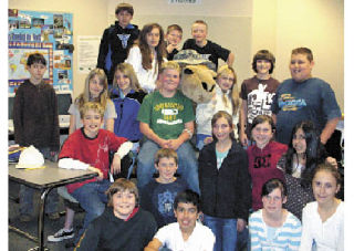 Melissa Molthan’s sixth-grade students at Haller Middle School pose with “Tank