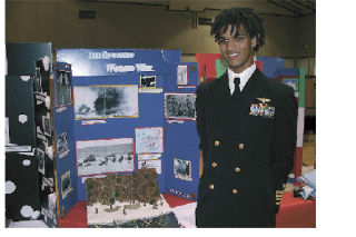 Lucas Revelle displays his project on World War II