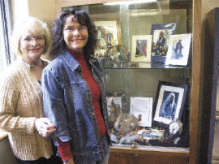 Cecelia Venolia and Janet Myer examine an exhibit of Myer’s work in a new 3-D display case at the Marysville Library. Myer’s work is also in the display case at the front entrance through the end of June.