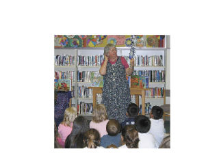 Dr. Margaret Read MacDonald speaks to all students at Eagle Creek Elementary School May 28 as an alternative to sending a few students to a young authors conference in Anacortes