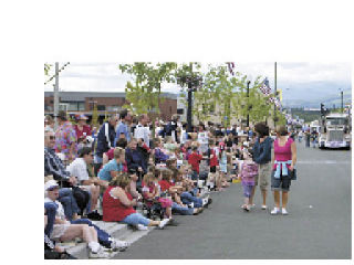 Crowds were four to six people deep as people waited anxiously for big trucks along North Olympic Avenue for the Fourth of July Grand Parade