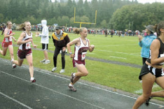 Lakewood coach Jeff Sowards cheers as junior Amber Burnell