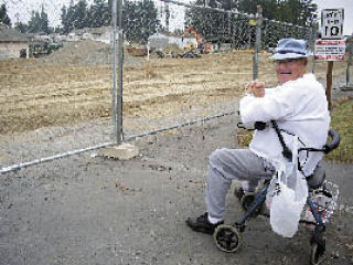 R.D. Conyers watches progress on a new construction project adjacent to the Stillaguamish Senior Center.