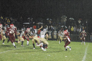 Arlington running back Kellen Botten regains his balance as he breaks through the Marysville defense in an early run.
