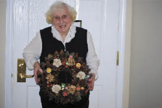 Alice Nordby Spane creates a wreathe to be raffled at the Loyal Heights Community Club’s annual bazaar Saturday