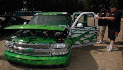 Judges check out a heavily modified Chevrolet truck during last year’s Sittin Pretti “Summer Slam” car show. This year’s event takes place Aug. 21.