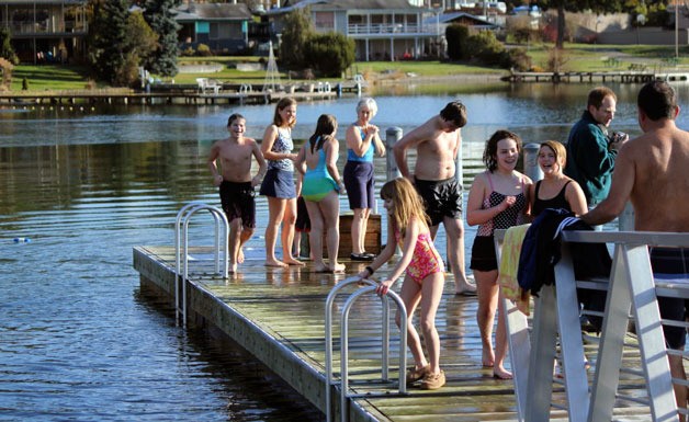 Three area families prepare to take a “polar bear” plunge on New Year’s Day at Lake Goodwin.