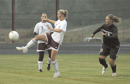 Maddie Chamberlin tries to settle a punt at midfield