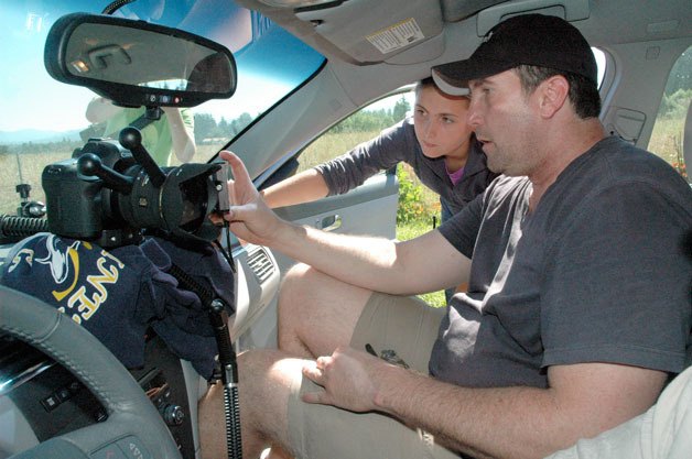 Chloe and Jonathan Holbrook check out the car-camera footage during their June 30 shoot for the upcoming ‘Still’ web series.