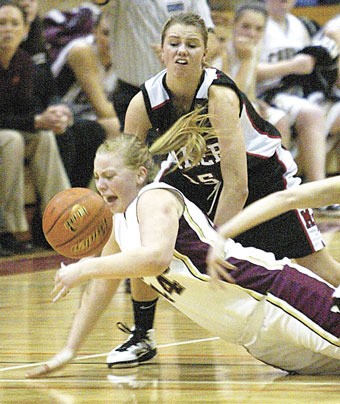 Lakewood junior Kaylee Diggs dives on the ground for a loose ball.