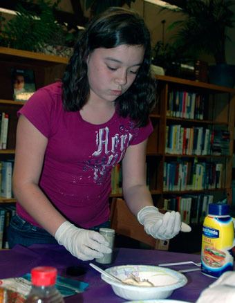 Abigail Palmer mixes her ingredients with care during the Oct. 20 cooking competition in the Arlington Library.