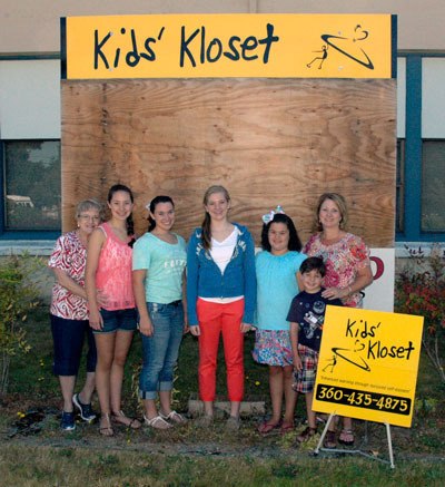 The Meno family are among the average of 7-10 volunteers who are continuing to put in between 100-150 hours of work between them each week at the Arlington Kidsâ€™ Kloset.