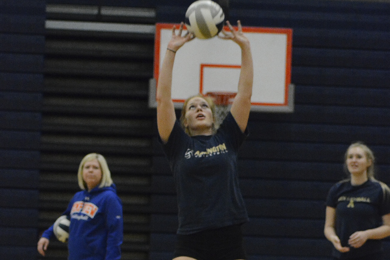 By Brandon Adam/Staff Photo                                Arlington’s Ally Peterson practices setting during a drill at a recent practice.