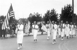 The Ladies of the Veterans of Foreign Wars walk in Arlington’s Fourth of July Parade in the 1930s. They are in the block where the post office is now located.