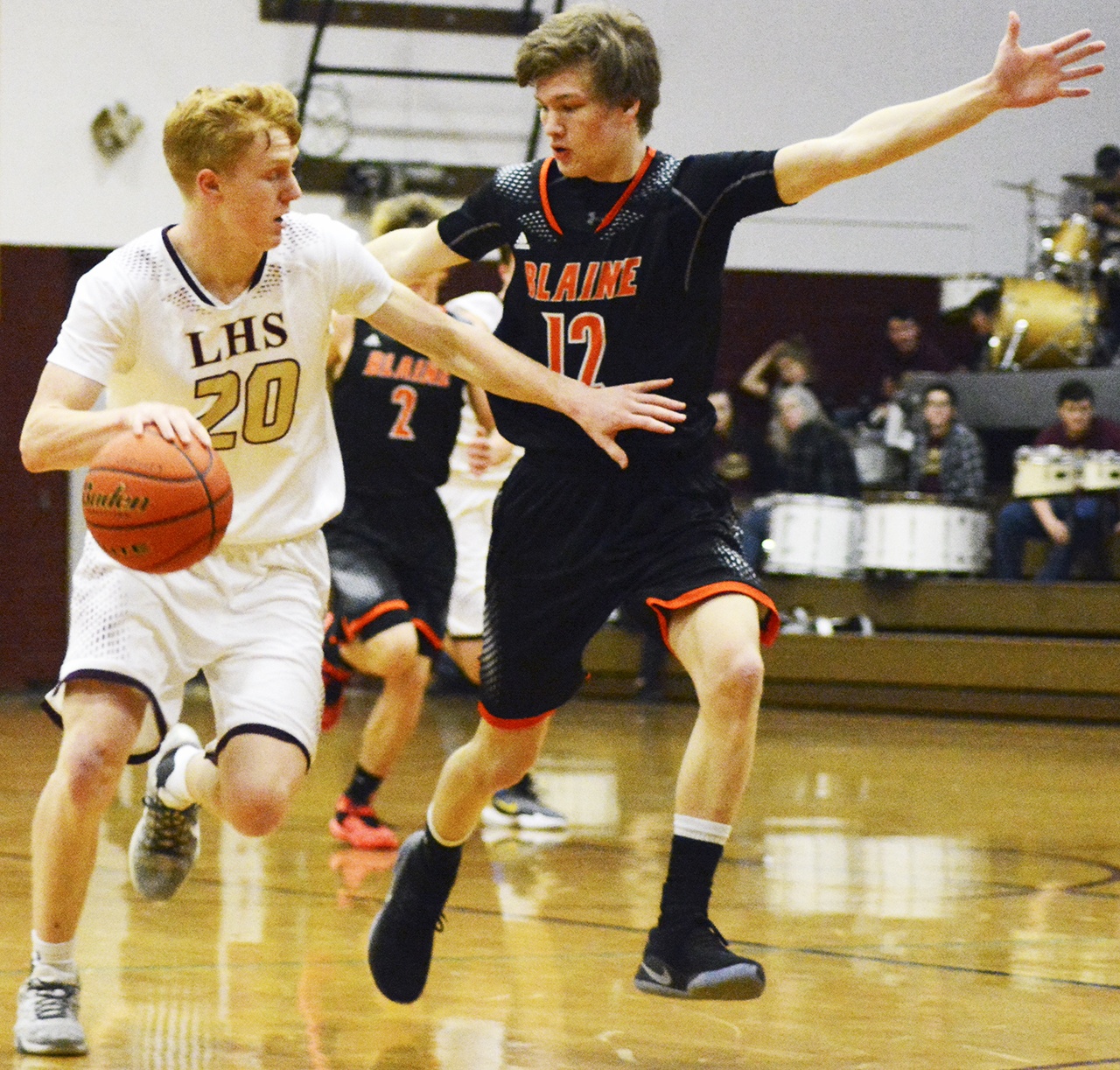 Lakewood’s Kaleb Duitsman dribbles against a Blaine defender on a breakaway. Brandon Adam/Staff Photo