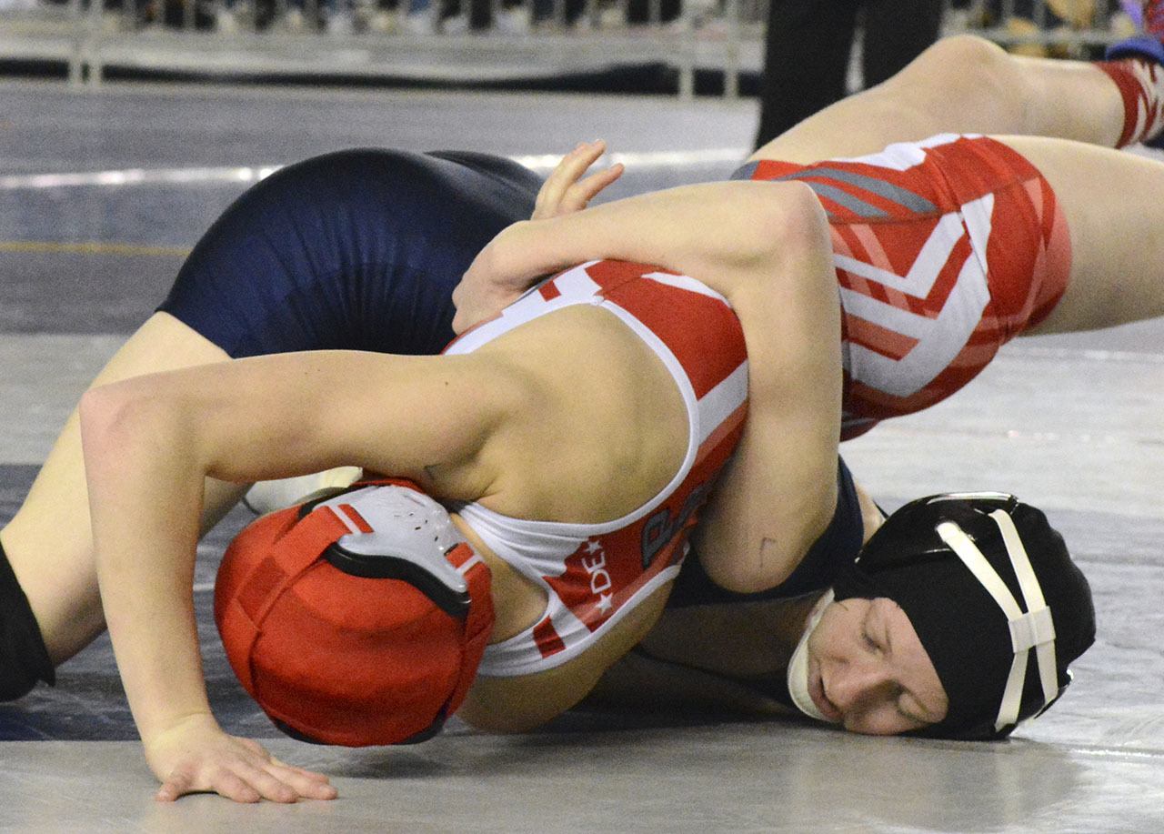 Arlington&rsquo;s Jordynn Mani works for a pin during her first-round match at the girls state wrestling tournament. Brandon Adam/Staff Photo