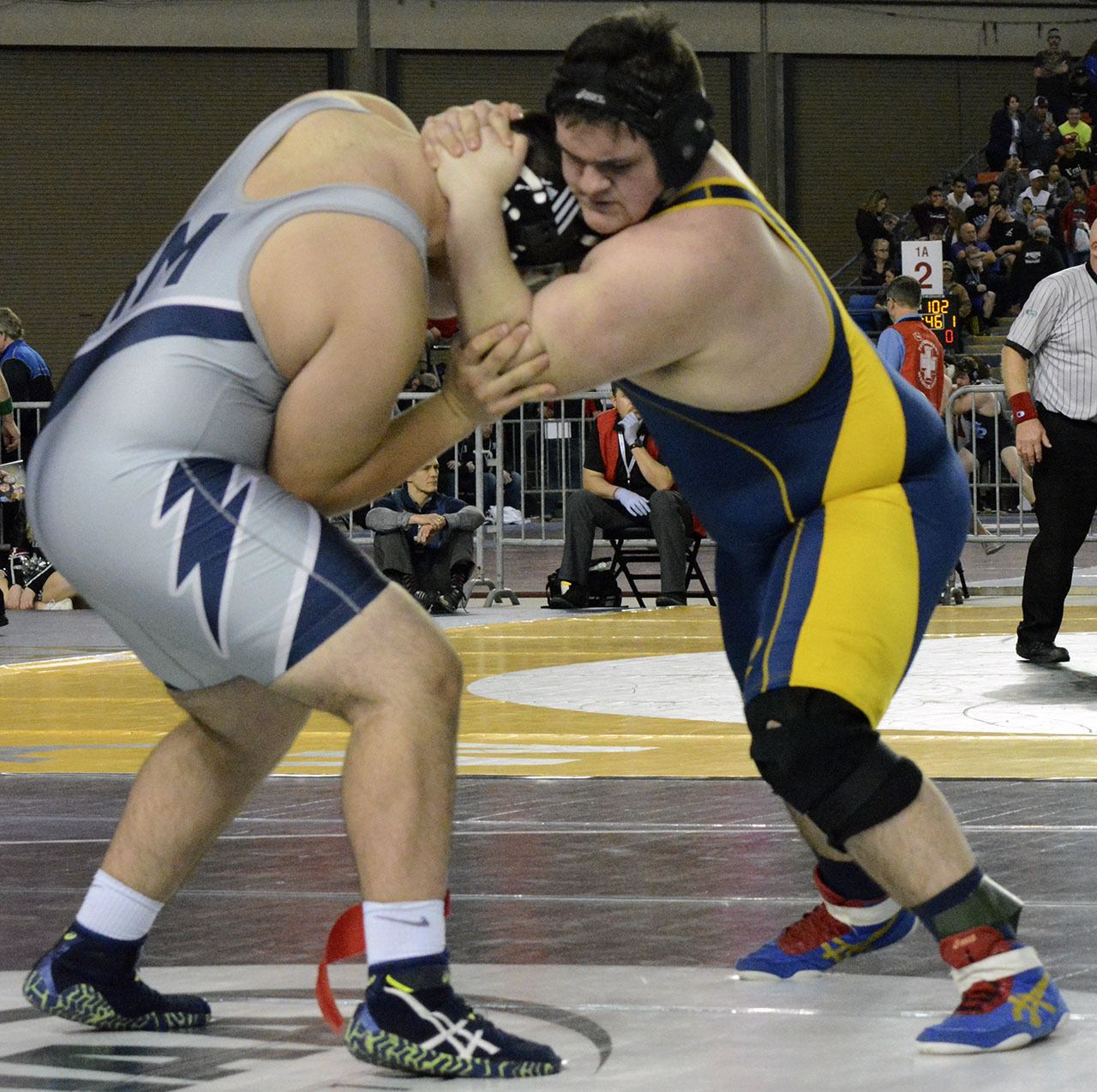 Arlington’s Tristan Emery competes in his first-round match at the 3A state tournament. Brandon Adam/Staff Photo