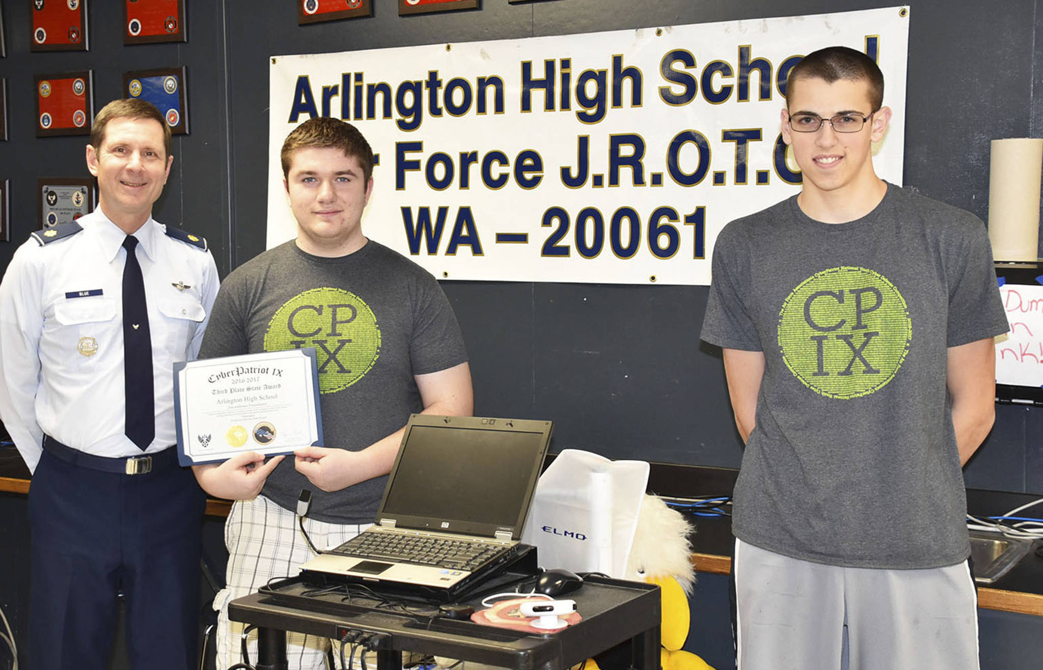 Senior aerospace science instructor Mike Blue, Cody Barschaw and Zechariah Rodino.