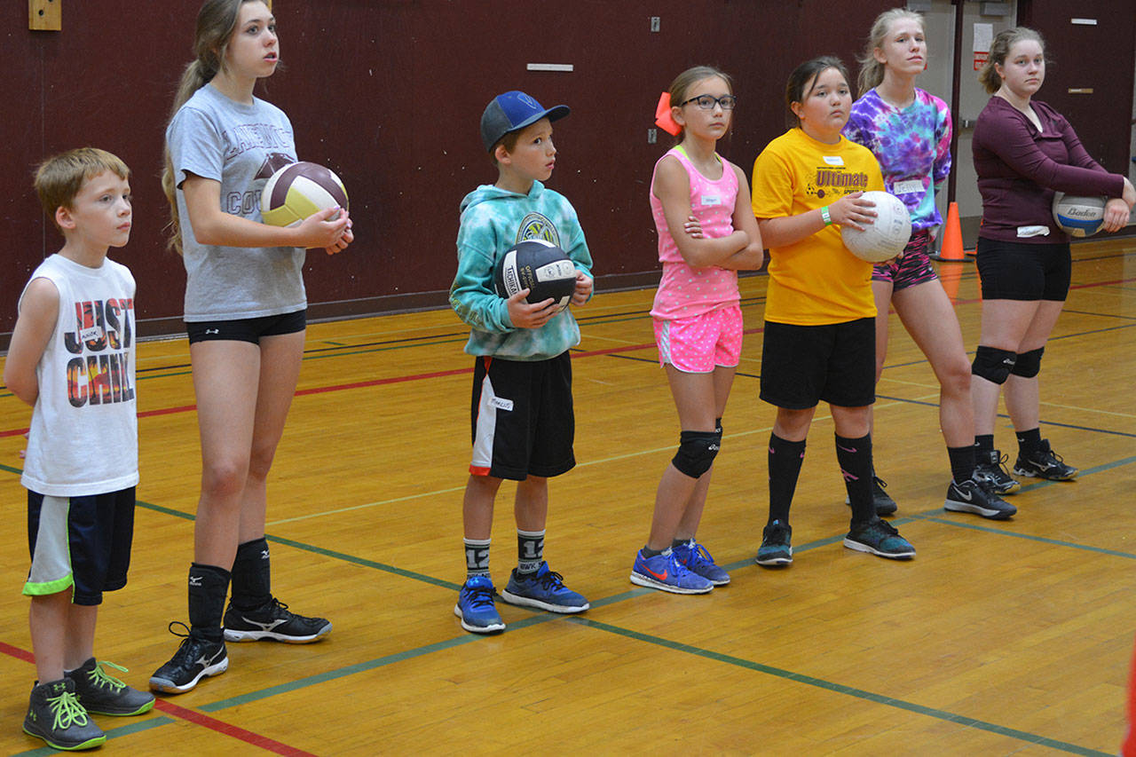 Recently retired volleyball coach coaching volleyball this summer