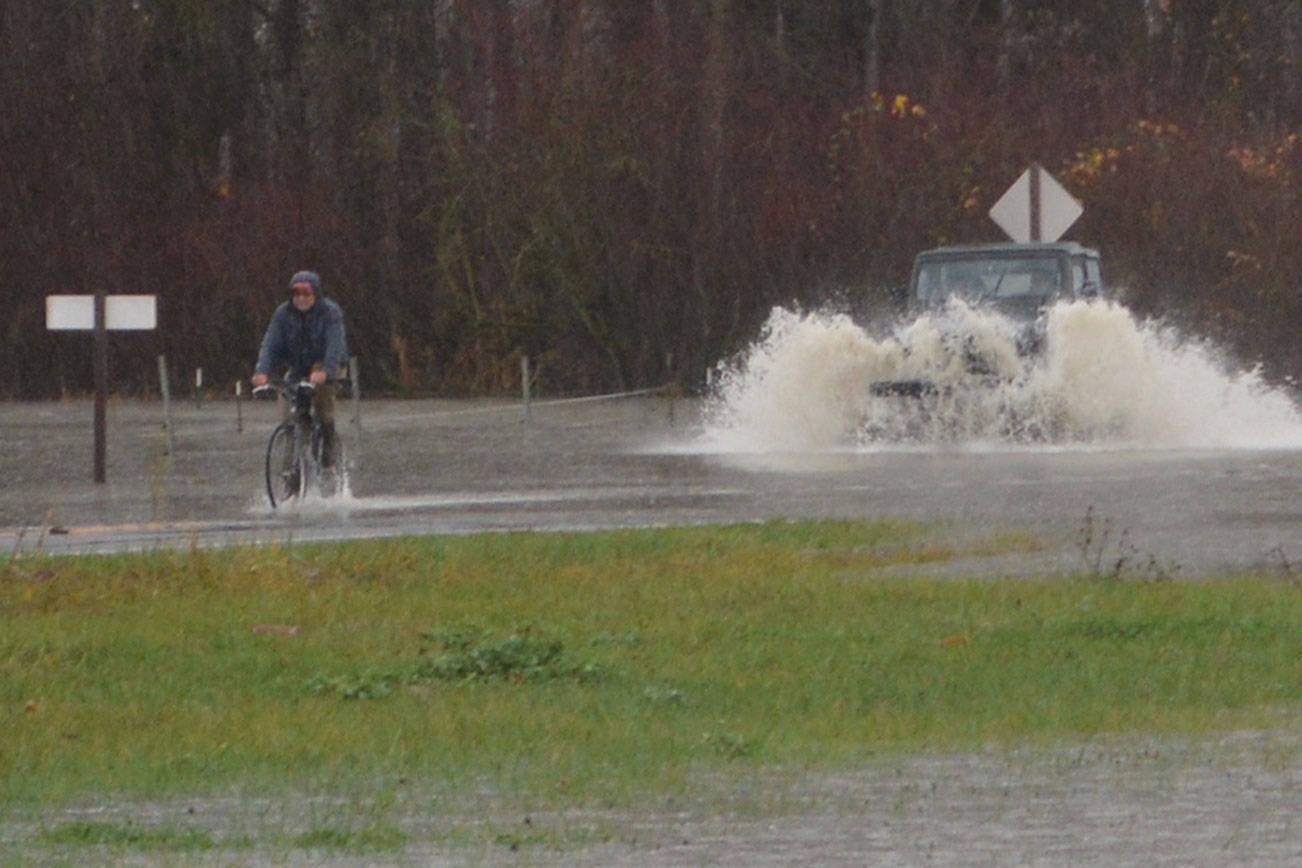 Rainy days and flooding never get bicyclist down in Silvana