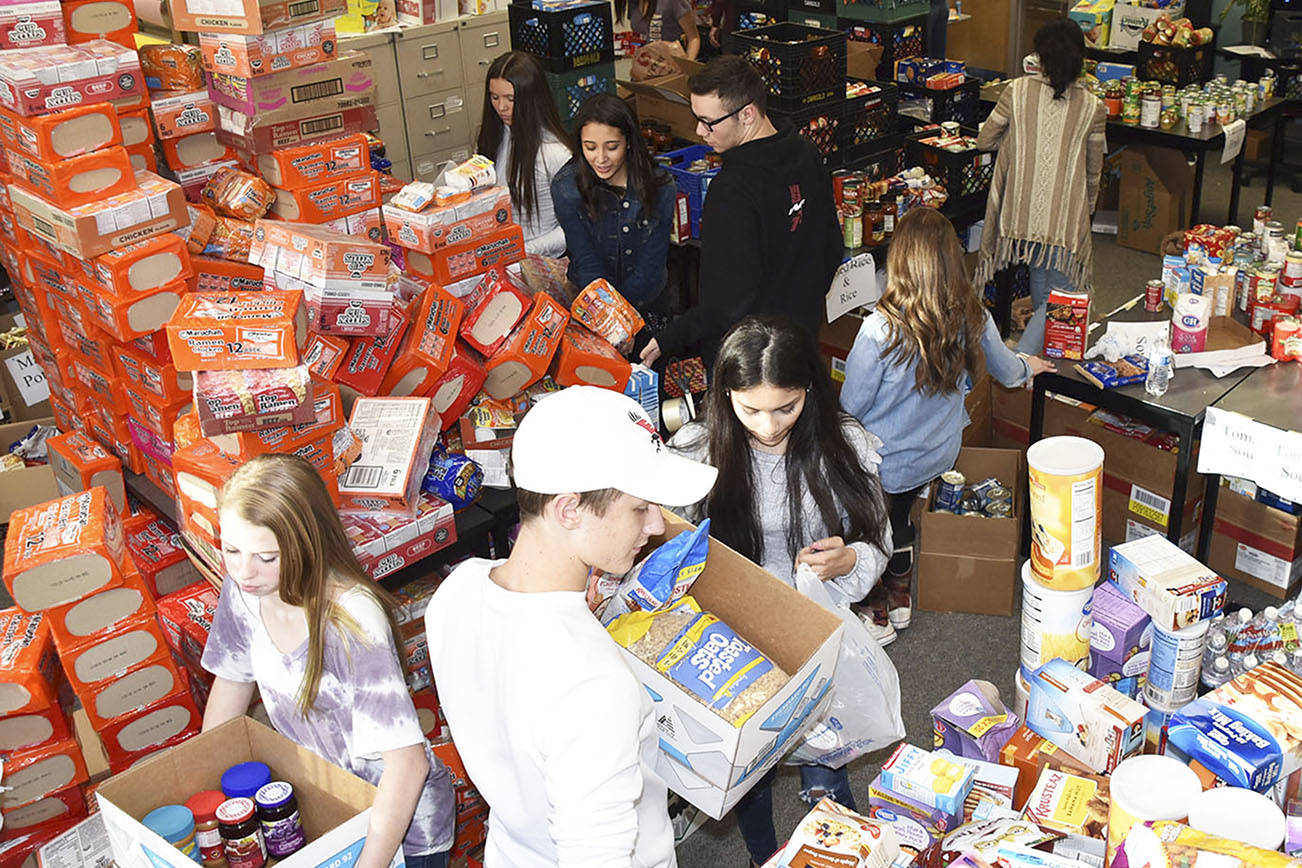 Arlington DECA club helps make holiday special for families
