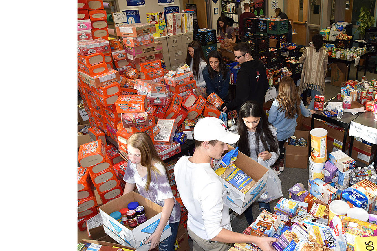 Arlington DECA gathers food, money for needy