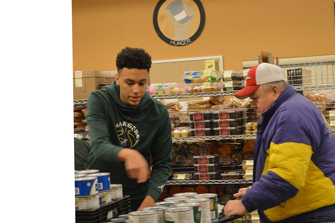 Helping people in need at food bank helps MG basketball players appreciate what they have