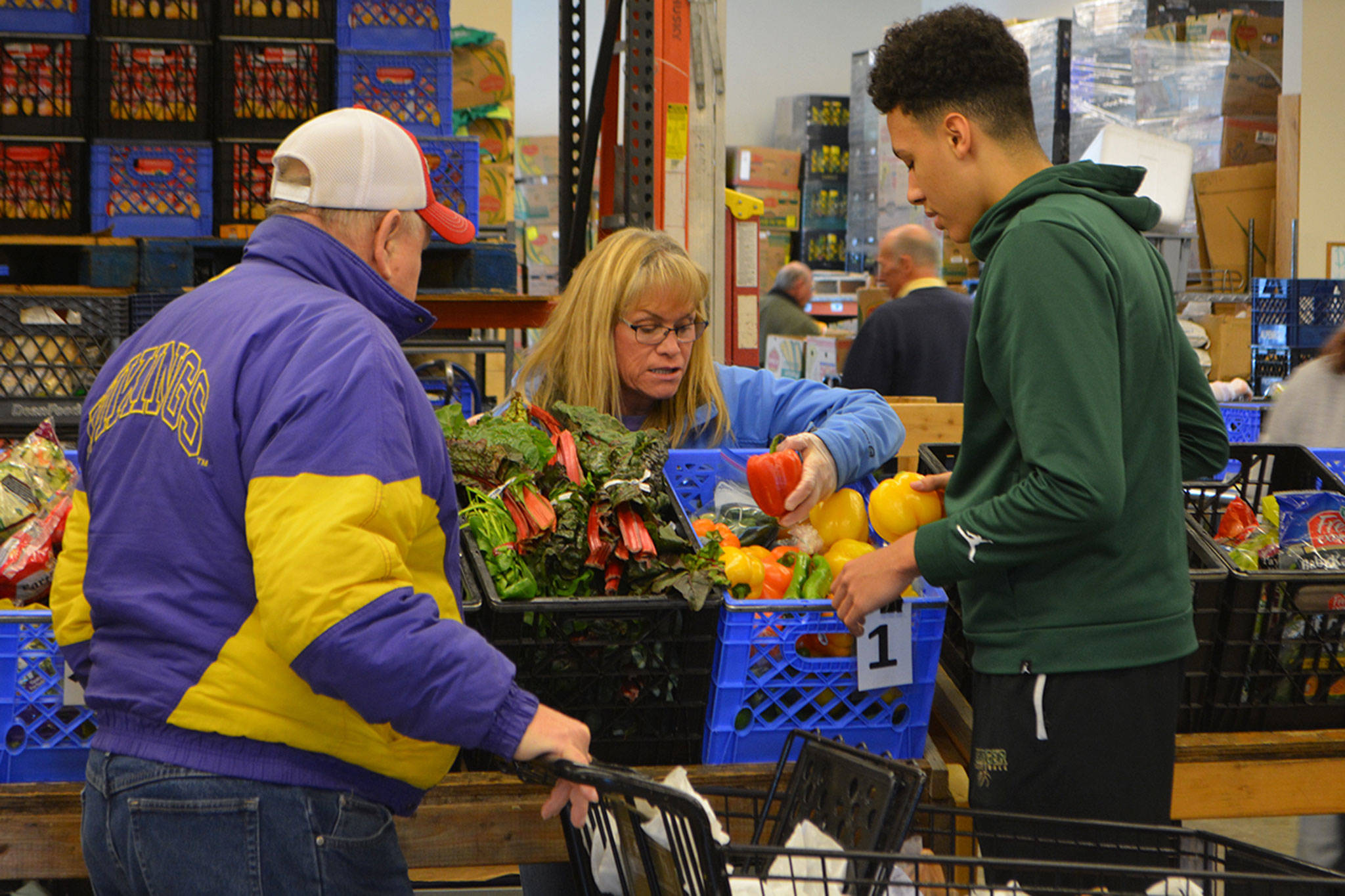 Helping people in need at food bank helps MG basketball players appreciate what they have