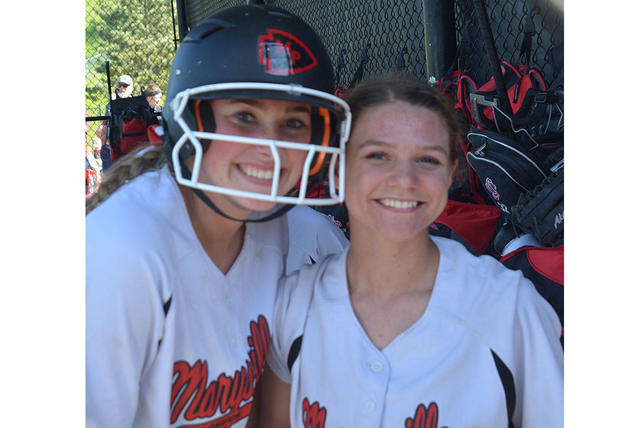 McKenzie Justice, left, hit a home run and came within inches of another in M-P ‘s 12-1 win over Meadowdale Tuesday. Little Chloe Morgan actually outslugged the Tomahawk standout by hitting two home runs. One was the traditional over-the-fence variety. The other was the more-rare inside the park. (Steve Powell/Staff Photo)