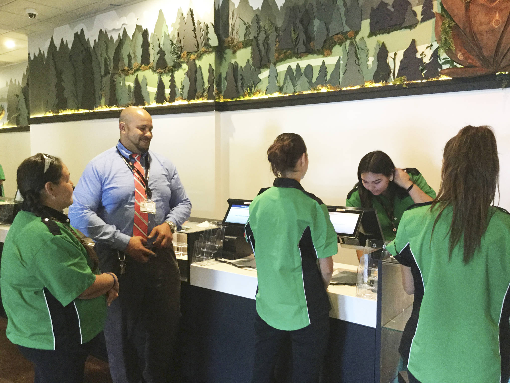 Jonathan Teeters, Asst. General Manager of Traditional Biologics Company (Remedy Tulalip) and concierges take trial runs preparing for the grand opening of Remedy Tulalip, a tribe-owned cannabis retail store that opened Friday.