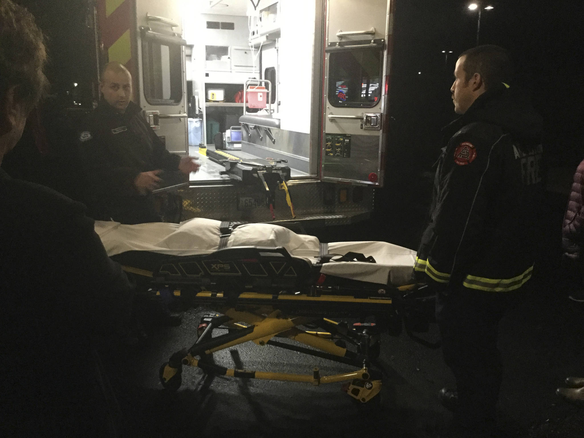 Firefighter-paramedics Nich Socha (left) and Gregg Haddick with the Arlington Fire Department demonstrate one of three new EMS Power Lift Cots acquired through a FEMA grant.