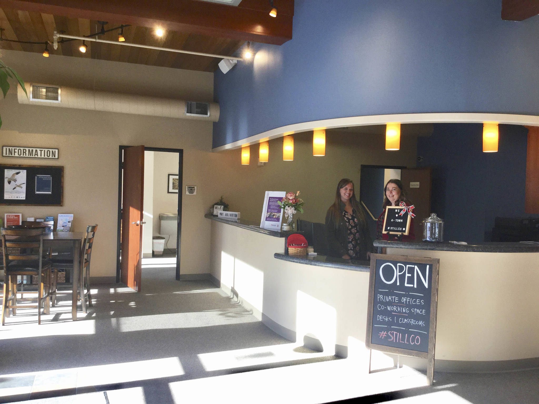 Jen Egger (right), executive director of the Stilly Valley Chamber of Commerce and Vicki Leatherman, chamber board member and office manager of Reaction Physical Therapy located upstairs, show off the lobby in the new StillCo co-working space on 3rd Street across from the police department and City Hall.