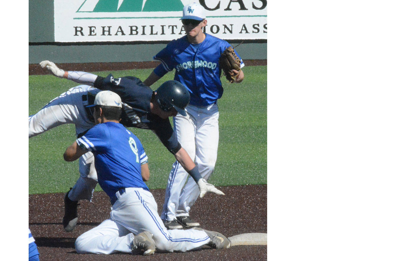 After oversliding second base, Eagle Cole Warner somehow managed to avoid this tag to be safe. (Steve Powell/Staff Photo)