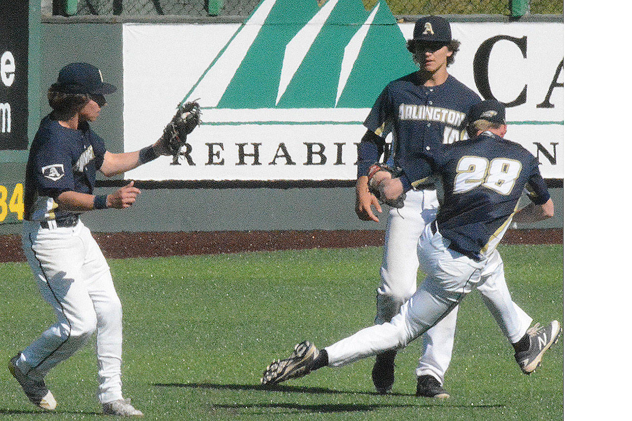 Eagle second baseman Cole Cramer (8) makes a catch, but centerfielder Owen Bishop (28) had to run away at the last second to avoid a collision as rightfielder Mike Tsoukalas also runs in on the play. (Steve Powell/Staff Photo)