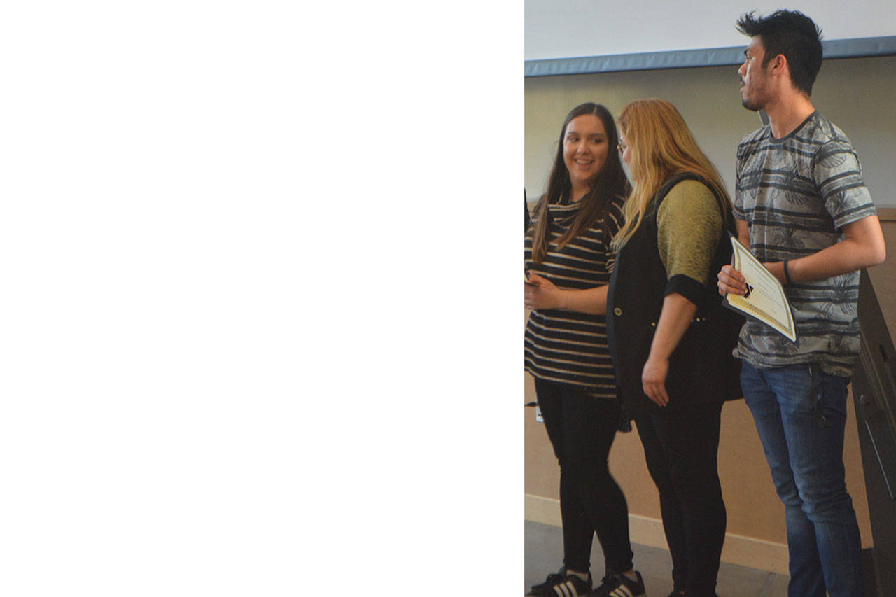 Ivanna Garza, with mom Ada in middle, and Josue Palma won MAP scholarships.