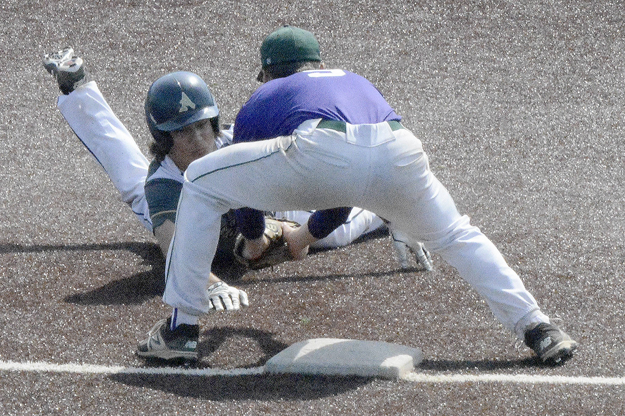 Steve Powell/Staff Photos                                 Michael Tsoukalas is thrown out at third trying to advance on a grounder to short.