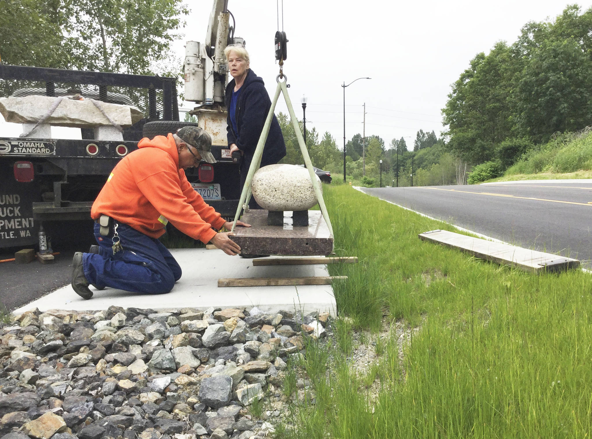 Artistic stone benches installed along Arlington Valley Road