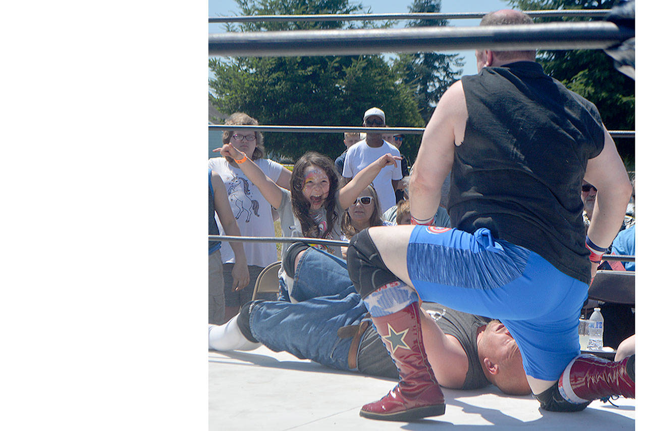 Jazzy cheers for one of the participants in the CTW Combat Pro Wrestling event at the Marysville Strawberry Festival Saturday. (Steve Powell/Staff Photos)